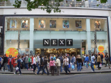 Next hits £1 billion profit milestone, raises outlook